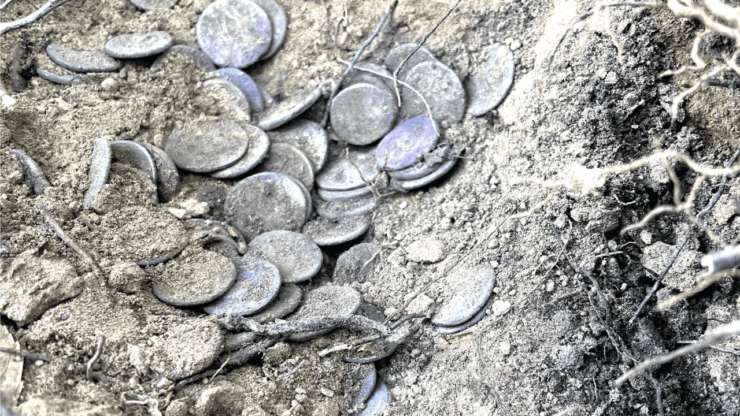 Buried treasure found in Italy with 200 Roman coins.