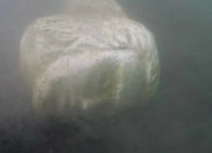 Stone head of Roman Emperor Caligula's ship found in Italian lake.